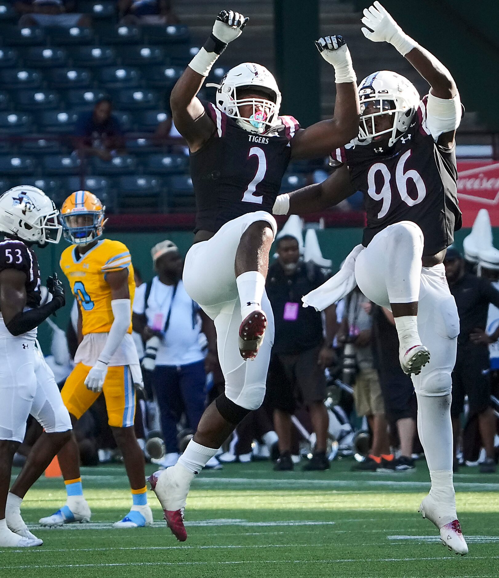 TSU defensive end Michael Akins (96) celebrates with defensive lineman Demontario Anderson...