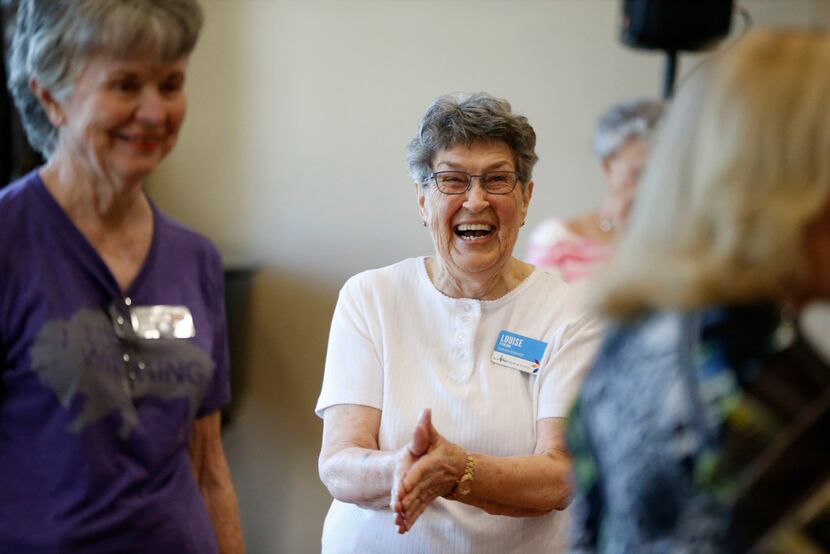 Louise Pierson claps during a line dancing class for seniors at Atria Canyon Creek in Plano.