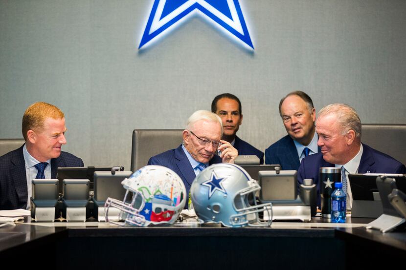 Dallas Cowboys Owner Jerry Jones, center, Head Coach Jason Garrett, left, CEO and Executive...