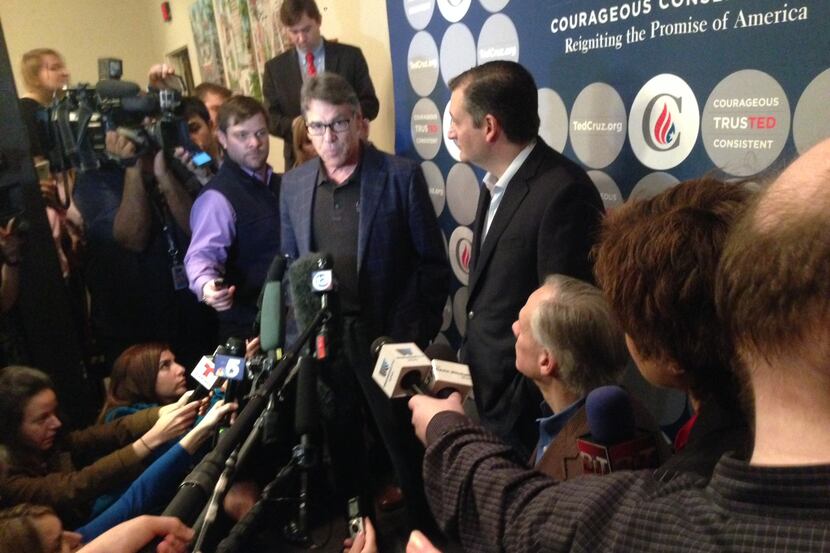 Former Gov. Rick Perry and Gov. Greg Abbott (seated, right) joined Sen. Ted Cruz for a news...