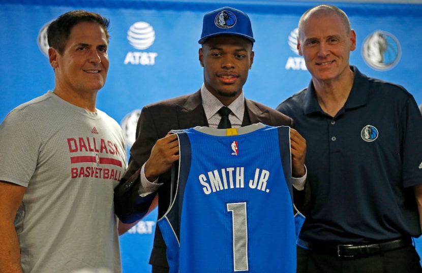 Mavericks first round pick Dennis Smith Jr. (center) poses for a photograph with Head Coach...