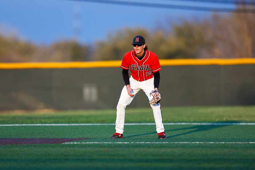 Rockwall-Heath third baseman Jonny Lowe stands ready for a hit during a district 10-6A high...