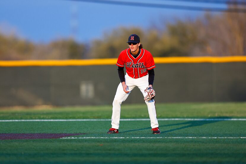 Rockwall-Heath third baseman Jonny Lowe stands ready for a hit during a district 10-6A high...