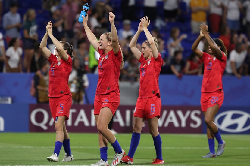 US players celebrate after the Women's World Cup semifinal soccer match between England and...