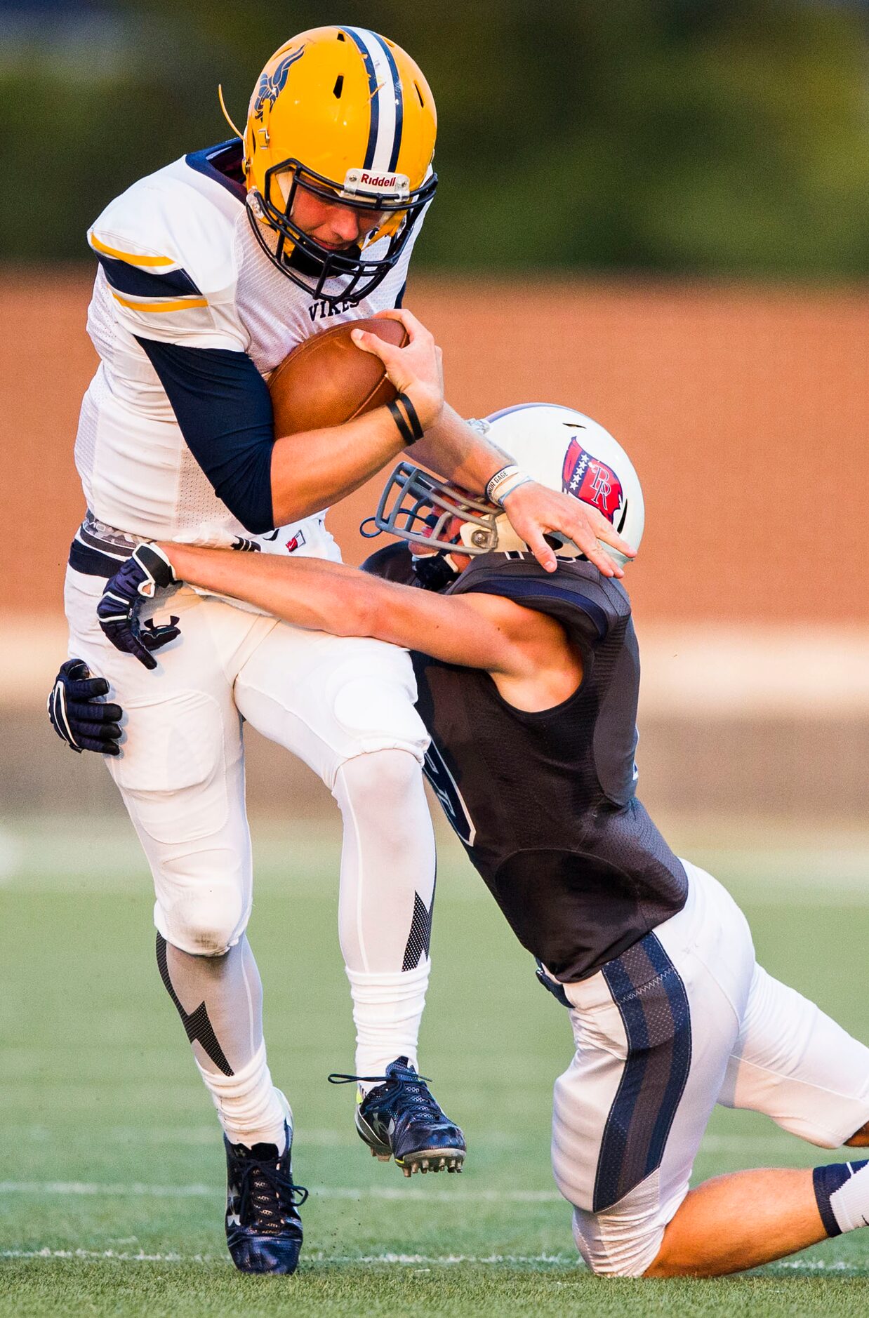 Arlington Lamar High School quarterback Shane Buechele (7) is tackled by Richland High...