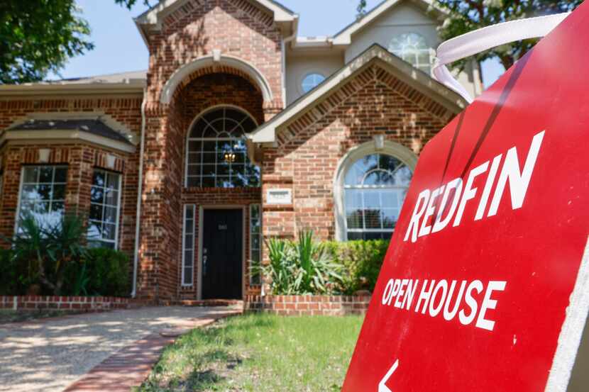 An “open house” sign is displayed outside of a house on Saturday, June 24, 2023 in Plano....