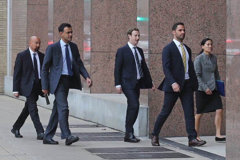Facebook CEO Mark Zuckerberg arrives with his entourage at the Earl Cabell Courthouse in...