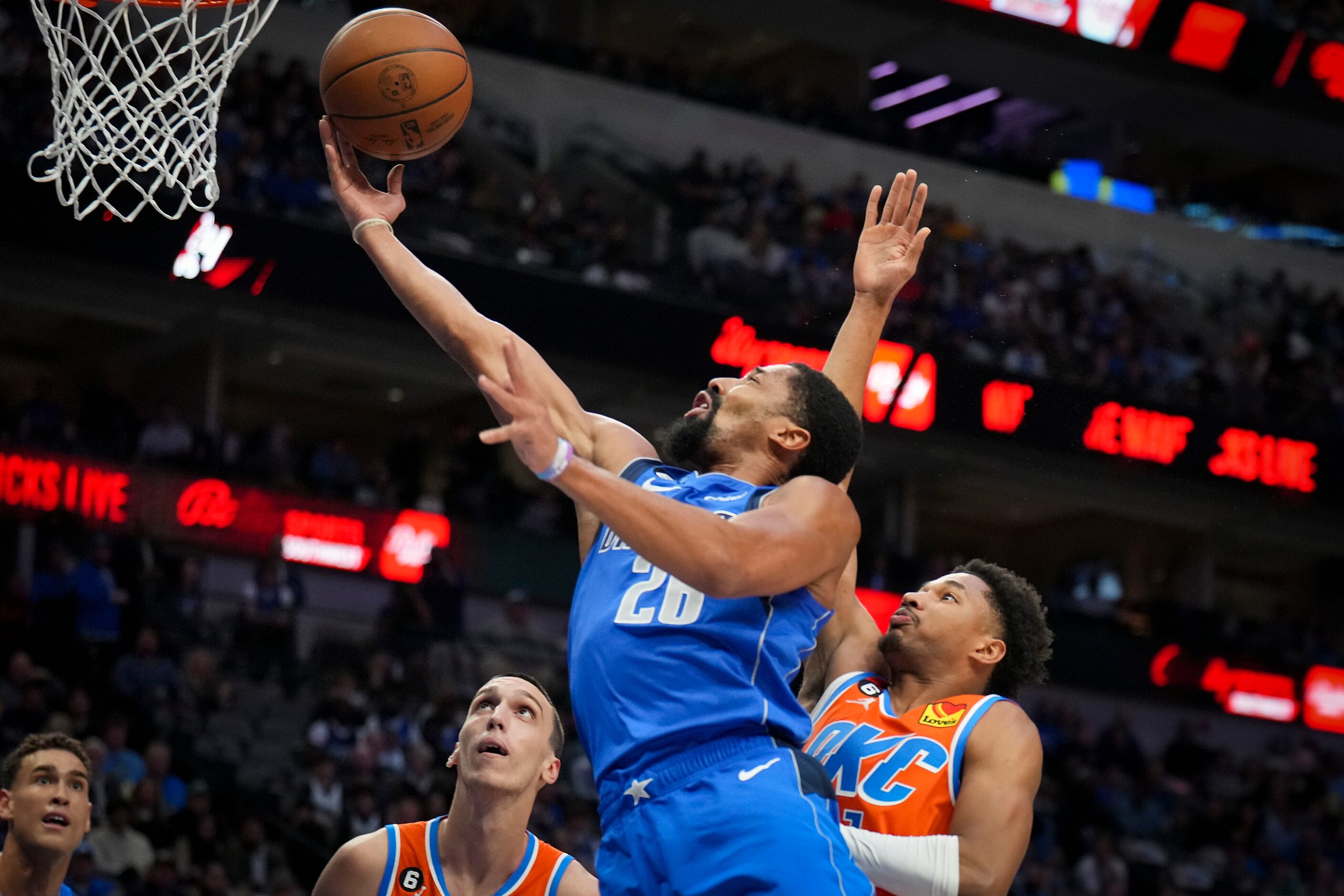 Dallas Mavericks guard Spencer Dinwiddie (26) drives to the basket during the first half of...