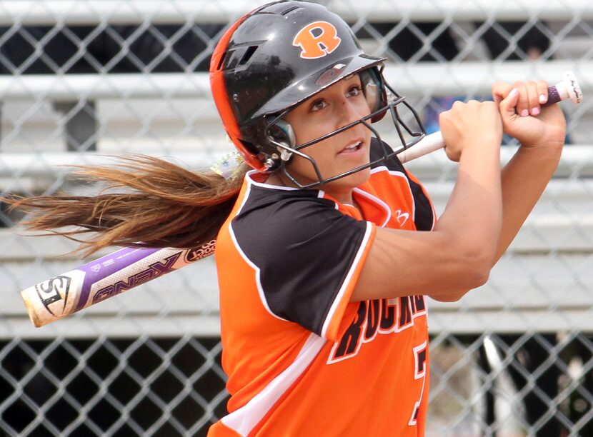 Rockwall's Bailey Wallace (7) watches as her line drive heads to drop for a base hit with...