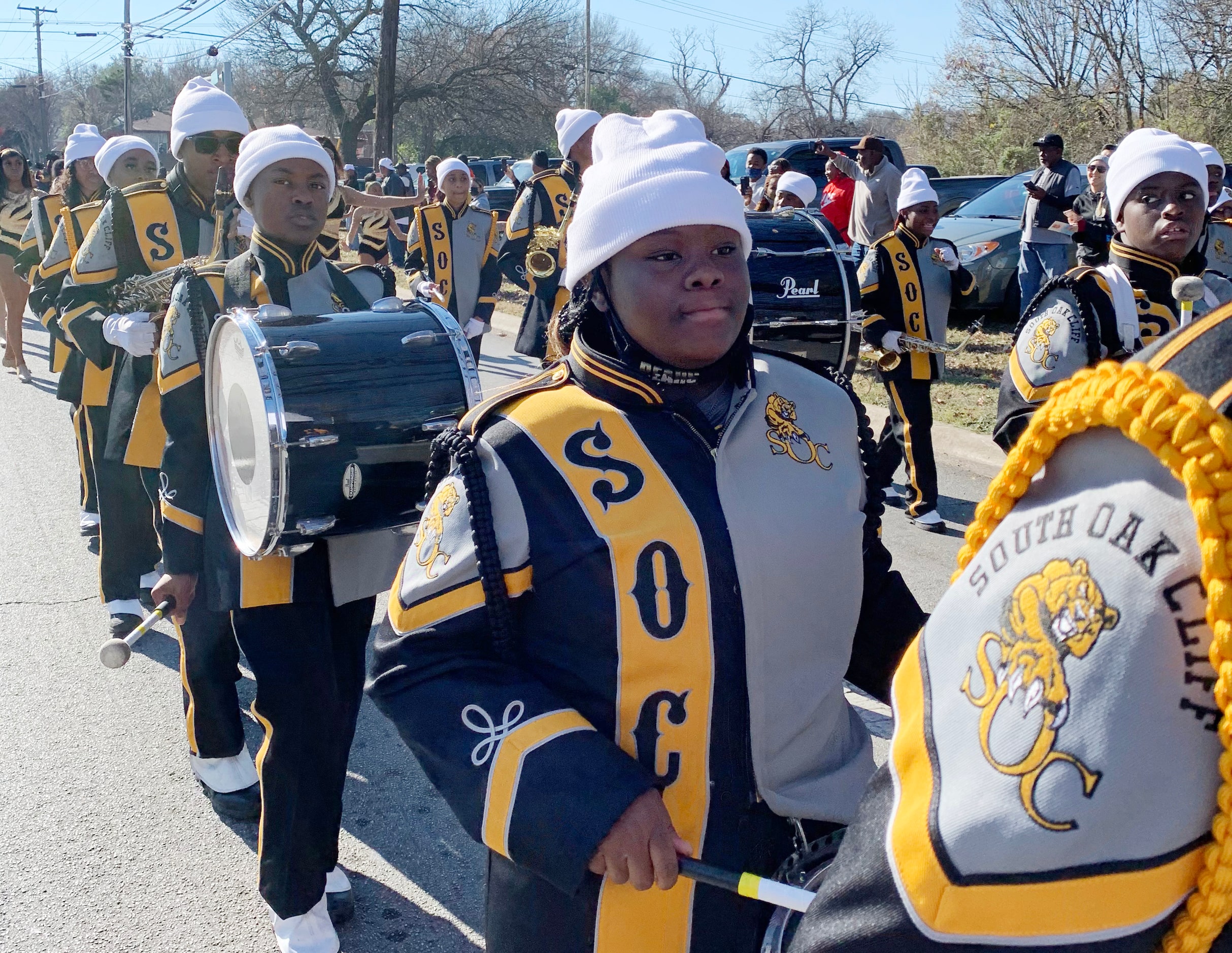 South Oak Cliff High School band members line the streets as Dallas celebrates the campus'...