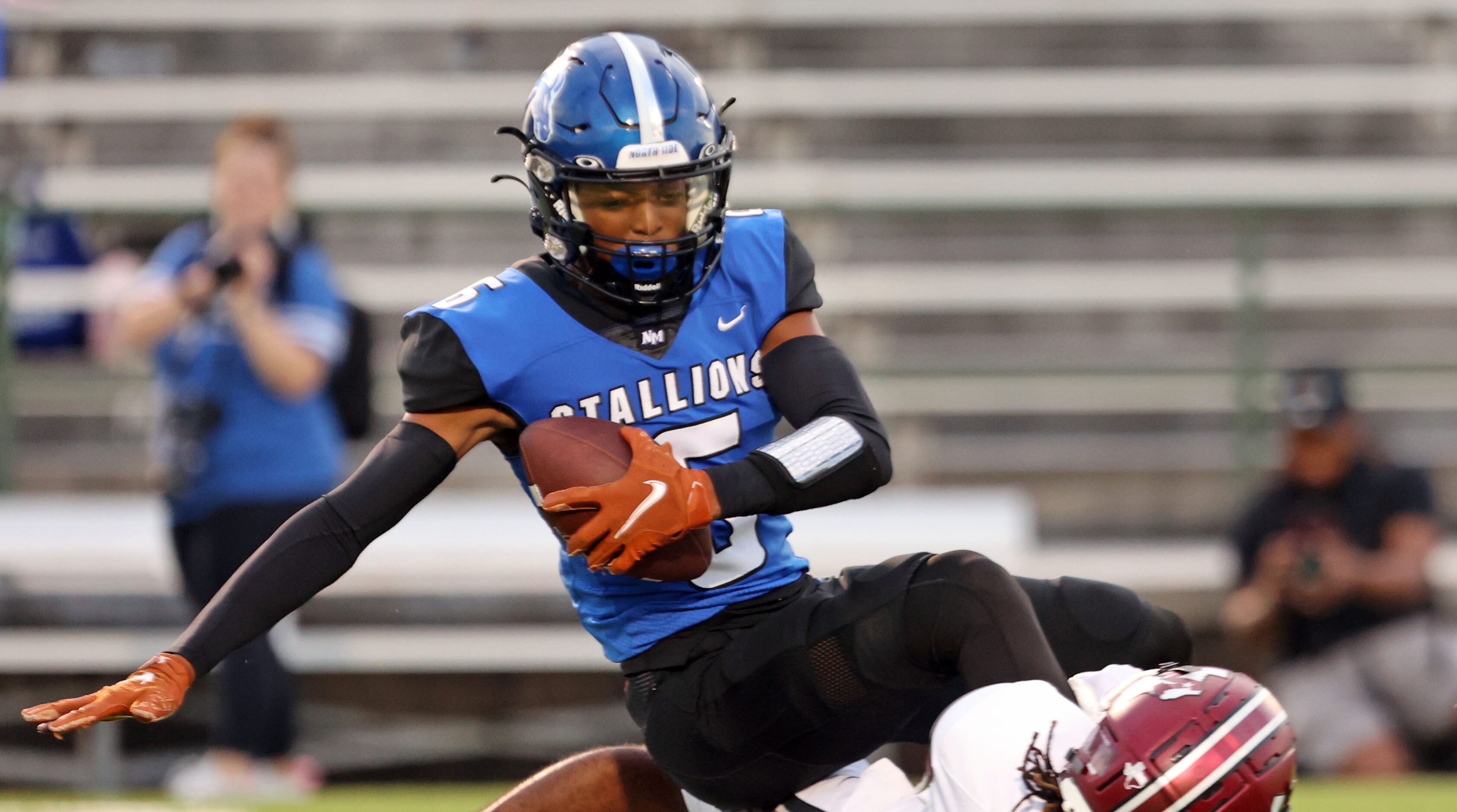 North Mesquite High’s Cordale Russell (5) grabs a pass over a Mesquite defender for a first...