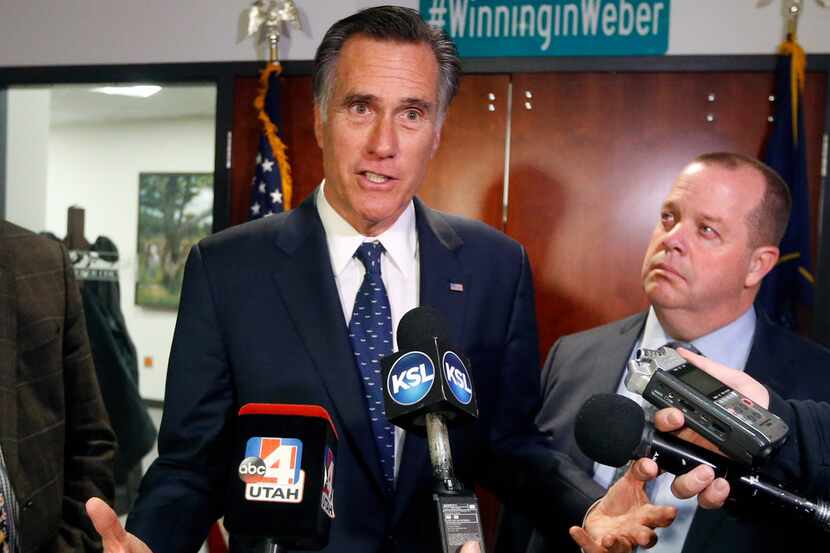 Sen. Mitt Romney, R-Utah, (left) voted against a Texas federal judge nominee on Tuesday.