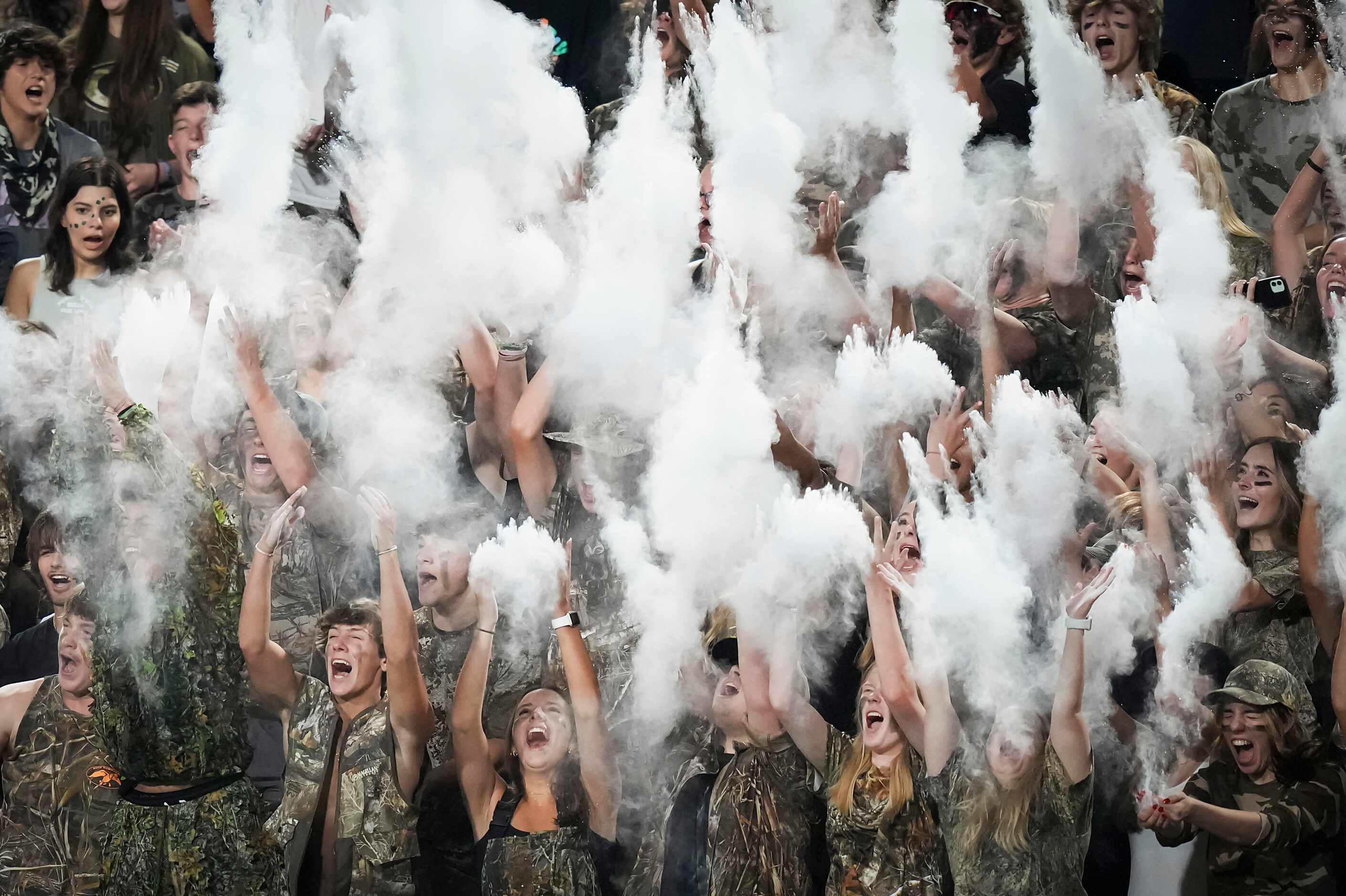 Denton Guyer students celebrate in a cloud of baby power during the final minutes of a...
