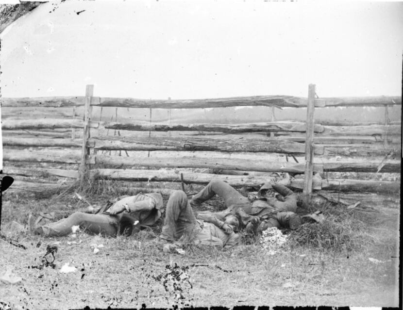 Dead of Stonewall Jackson's Brigade lie by rail fence on the Hagerstown pike at Antietam,...