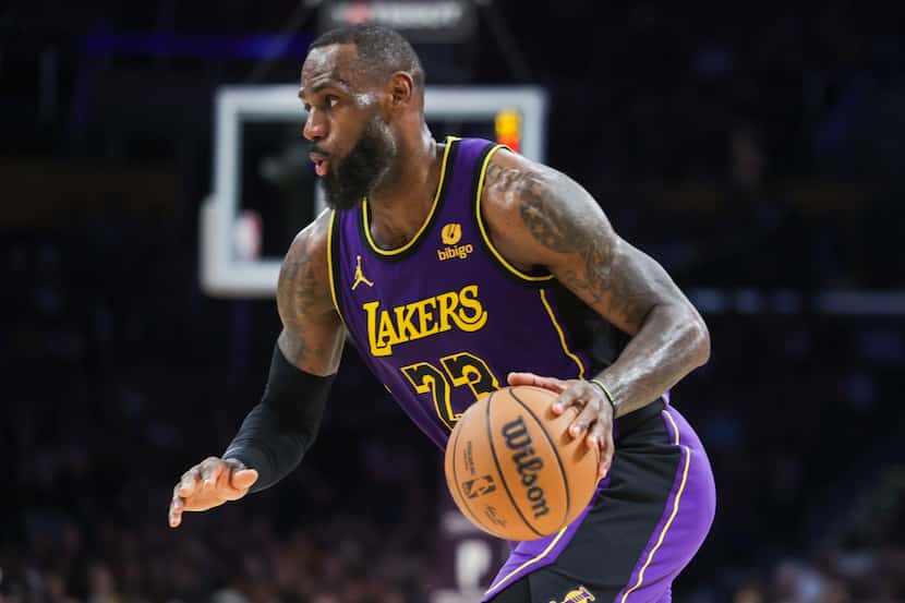 Los Angeles Lakers forward LeBron James (23) dribbles the ball during the second half of the...