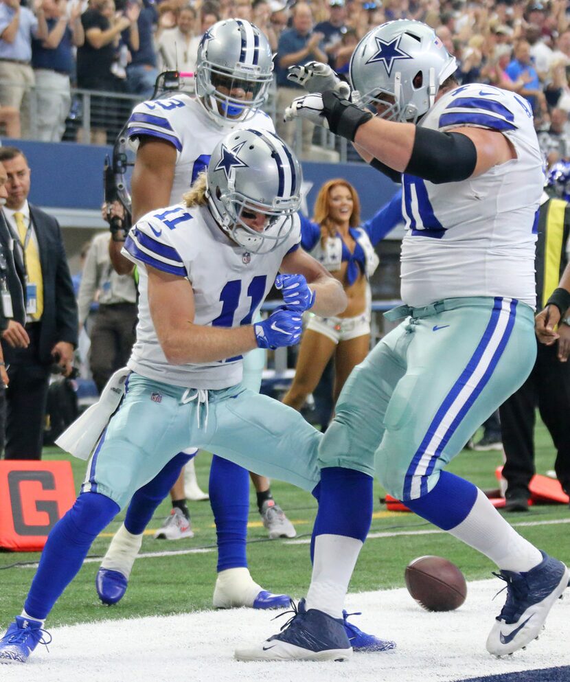 Dallas Cowboys wide receiver Cole Beasley (11) celebrates with teammates Terrance Williams...