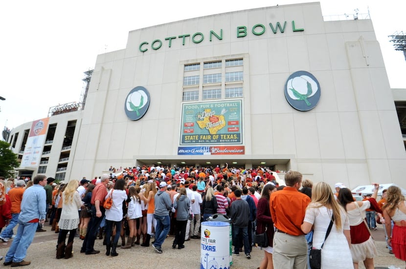 Fans line up on the steps of the stadium before the game at the University of Texas versus...