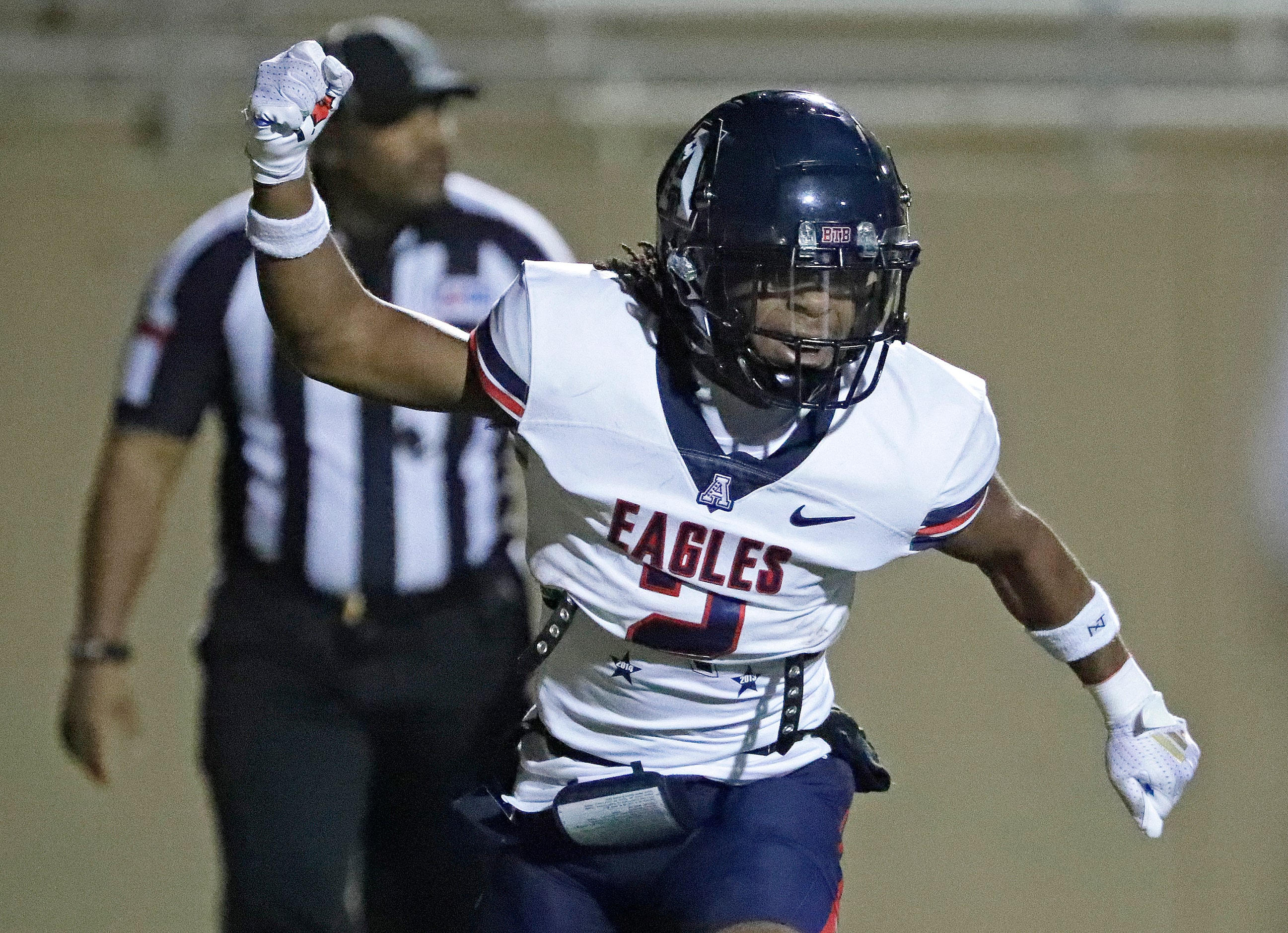 Allen High School running back Micah Ellis (2) celebrates his touchdown run during the first...