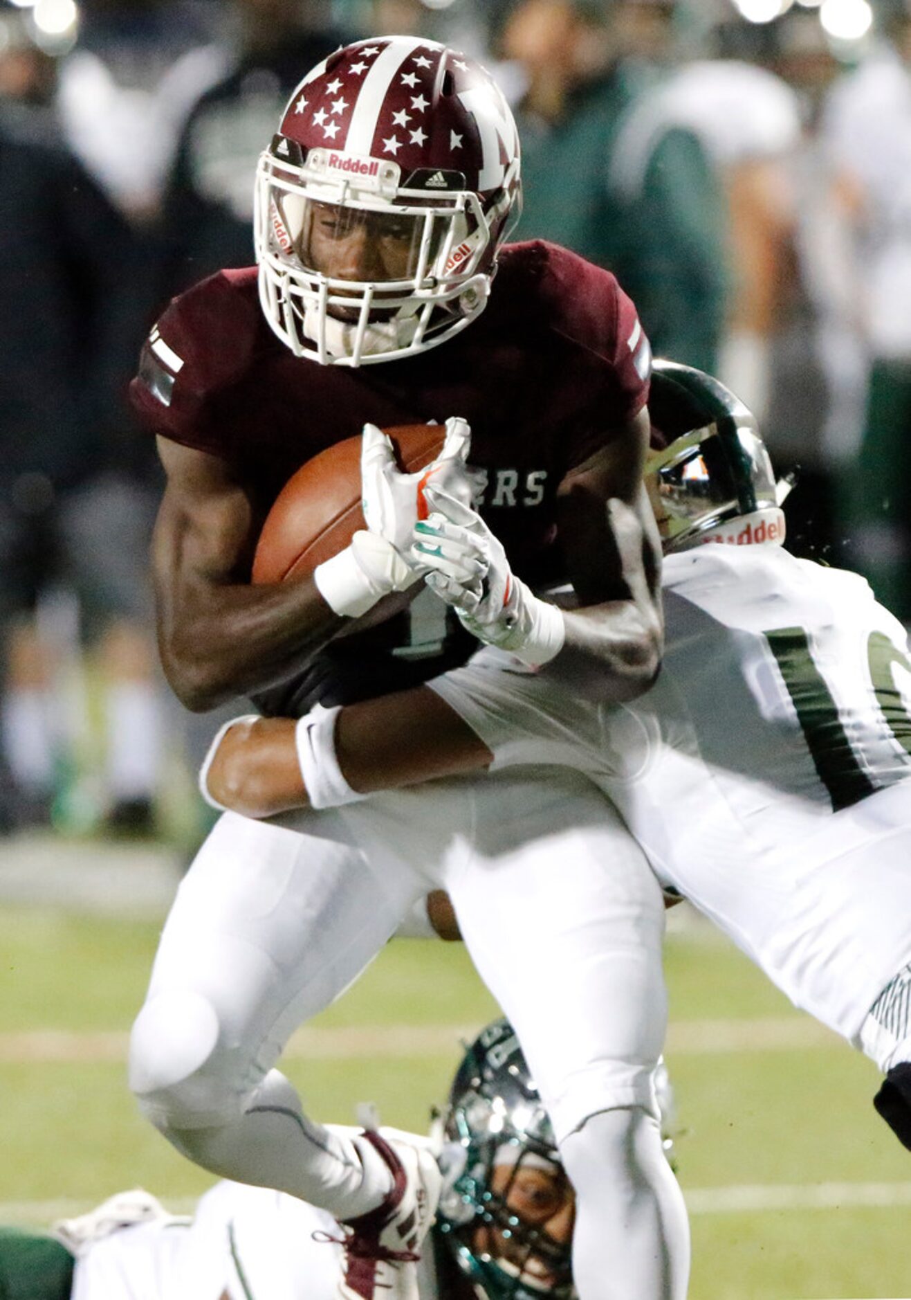 Mesquite High School running back Ladarius Turner (4) is tackled after a catch by Prosper...