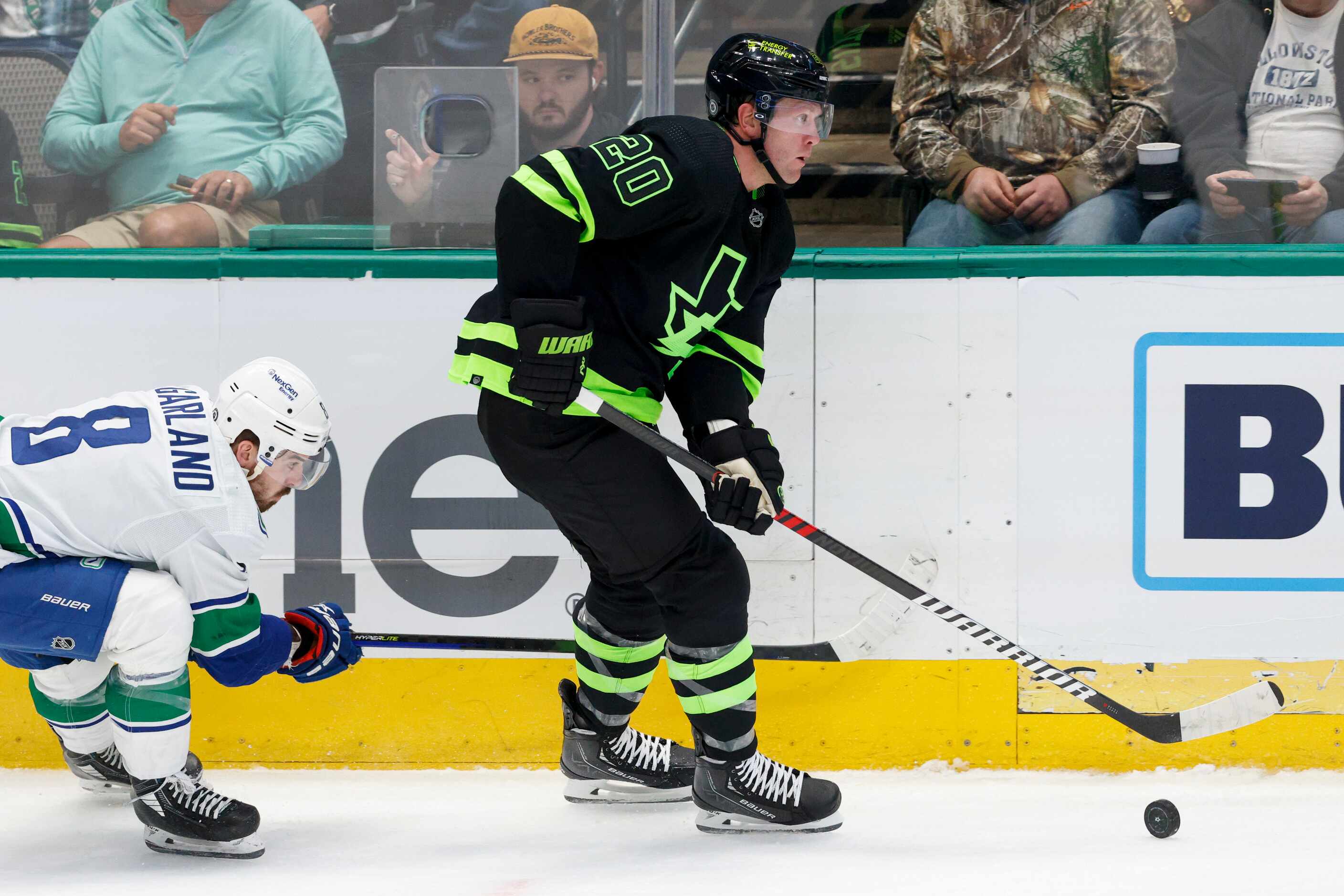 Dallas Stars defenseman Ryan Suter (20) skates up the ice ahead of Vancouver Canucks right...