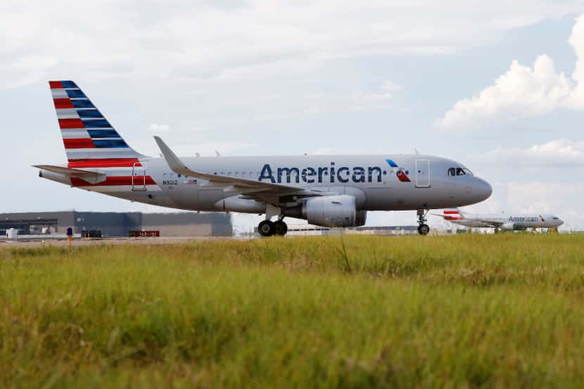 American Airlines planes taxi on the tarmac at DFW International Airport on Wednesday,...