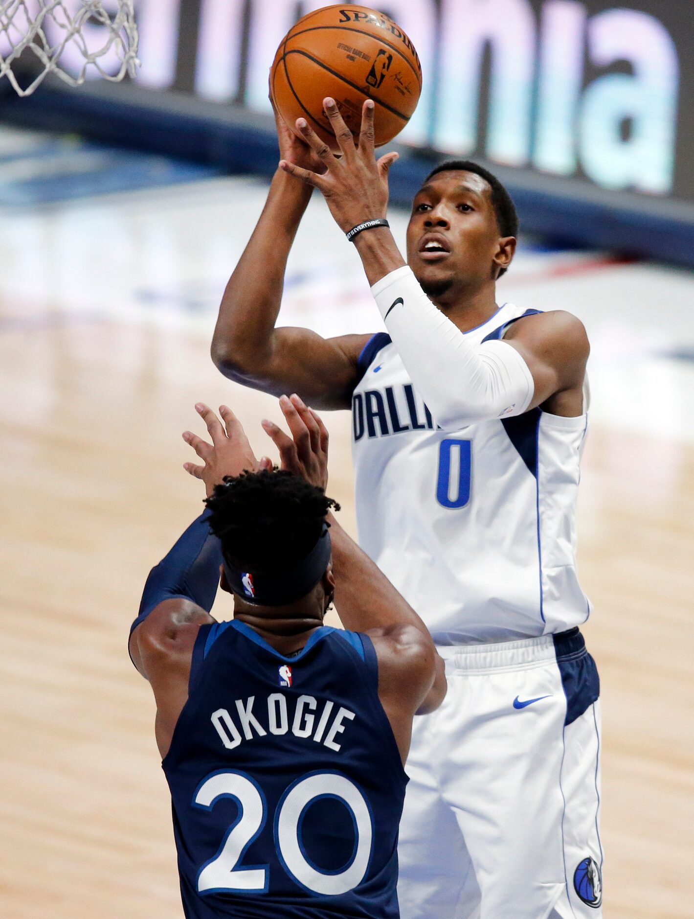 Dallas Mavericks guard Josh Richardson (0) puts up a shot over Minnesota Timberwolves...