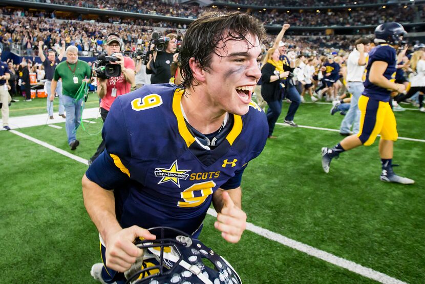 Highland Park quarterback John Stephen Jones runs onto the field in celebration as time...