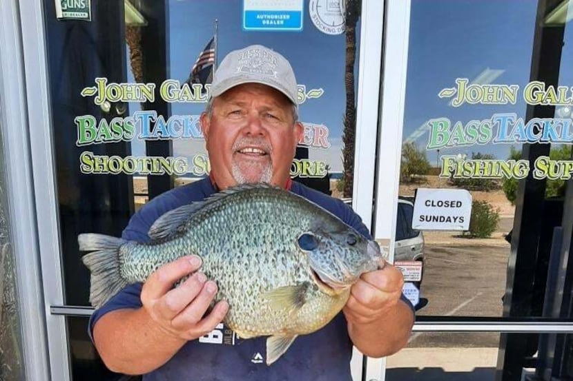 Thomas Farchione of Waterford, Wis., with the enormous 6.30 pound redear sunfish he caught...