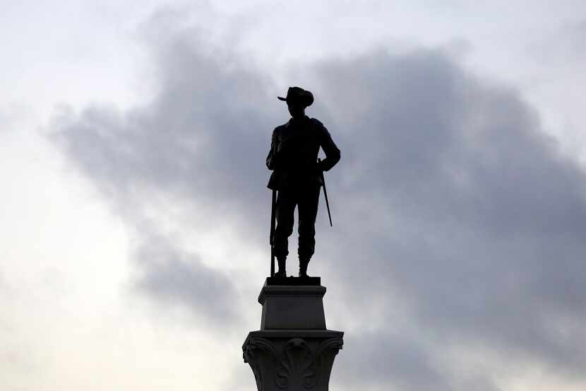 A Confederate soldier statue stands tall on the Texas Brigade monument on the east side of...