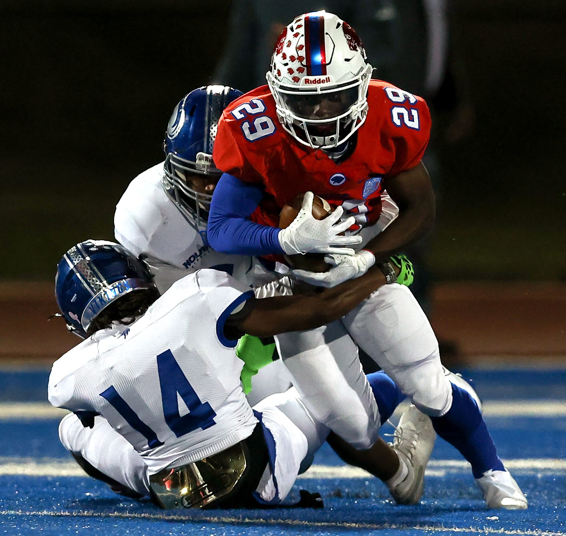 Parish running back Cedric Mays II (29) bulls his way over Nolan defensive back Trammell...