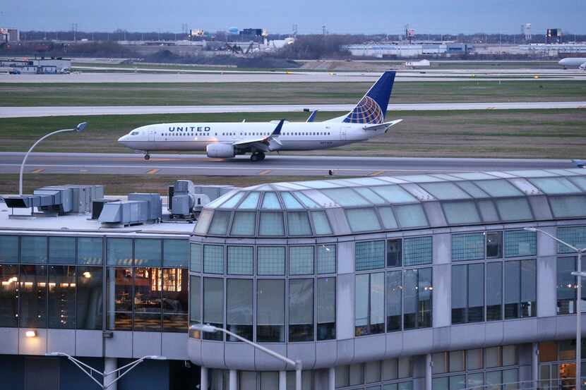 A United Airlines airplane rolls down the runway after landing at O'Hare Airport in Chicago. 