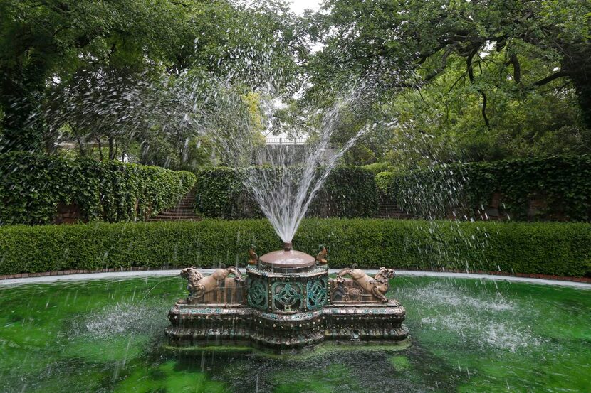 
A sunken oval water feature surrounds a pair of Chinese chi-lin dragons, a mythical...