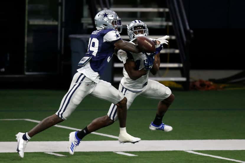FILE - Cowboys cornerback Chris Westry (39) deflects a pass intended for wide receiver...