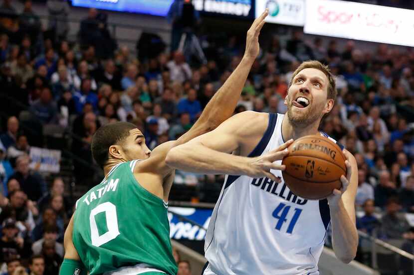 Dallas Mavericks forward Dirk Nowitzki (41) drives past Boston Celtics forward Jayson Tatum...