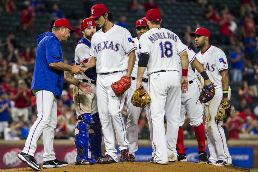 Texas Rangers starting pitcher Yu Darvish (11) is pulled from the game by Texas Rangers...