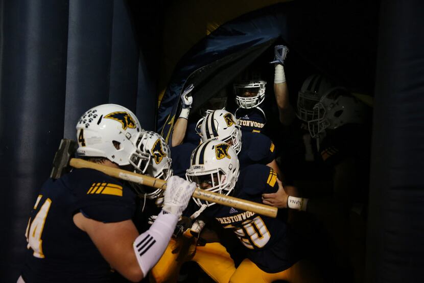 Prestonwood Christian players prepare to enter the field before a high school football game...
