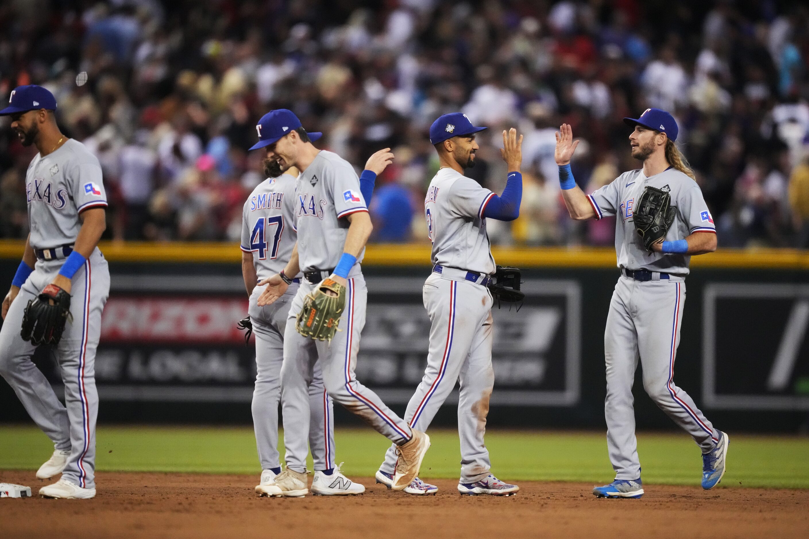 The Texas Rangers (from left) Leody Taveras, Josh Smith, Evan Carter, Marcus Semien and...