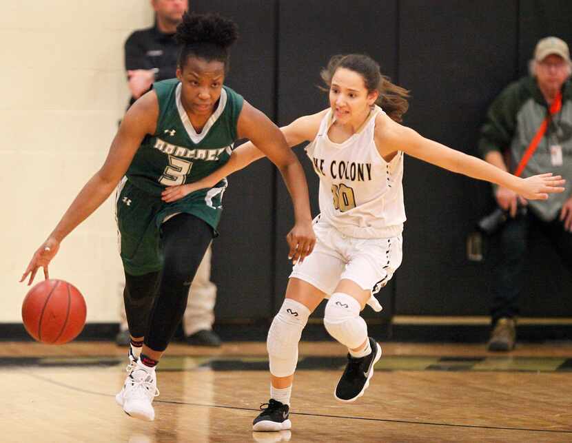 Proper post Jordyn Oliver dribbles down the court while defended by The Colony gaurd Hannah...