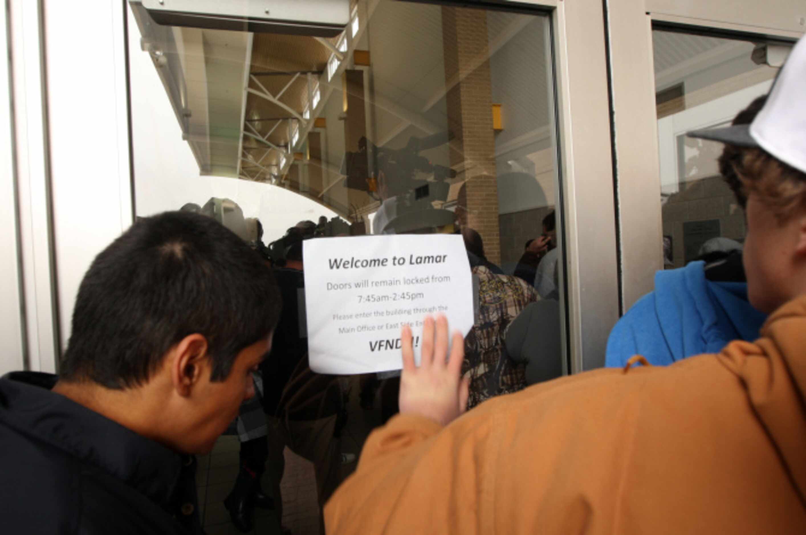 Parents wait to be let into the school to pick up their kids after a lockdown at Arlington...