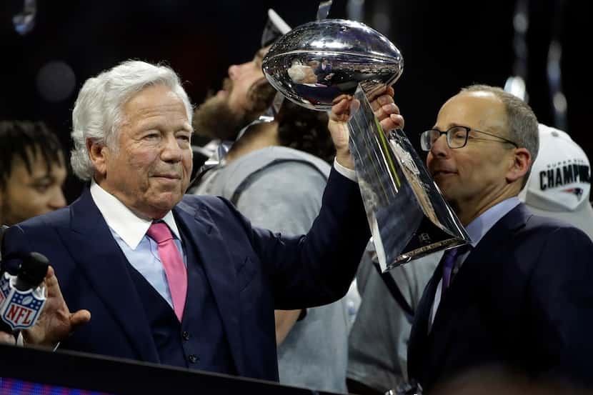 New England Patriots owner Robert Kraft holds the Vince Lombardi trophy, after the NFL Super...
