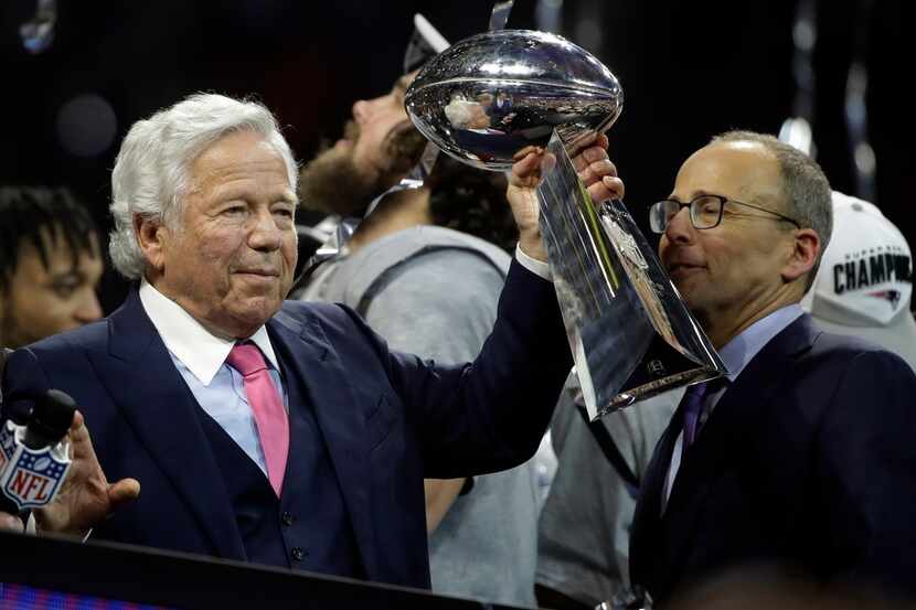 New England Patriots owner Robert Kraft holds the Vince Lombardi trophy, after the NFL Super...