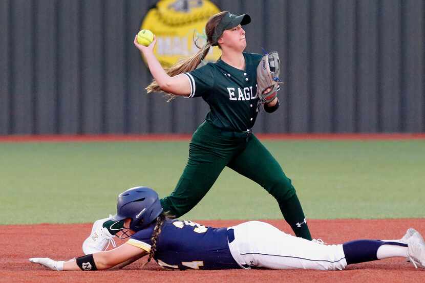 Prosper shortstop Abbey Beasley makes the throw for a double play during the second inning...