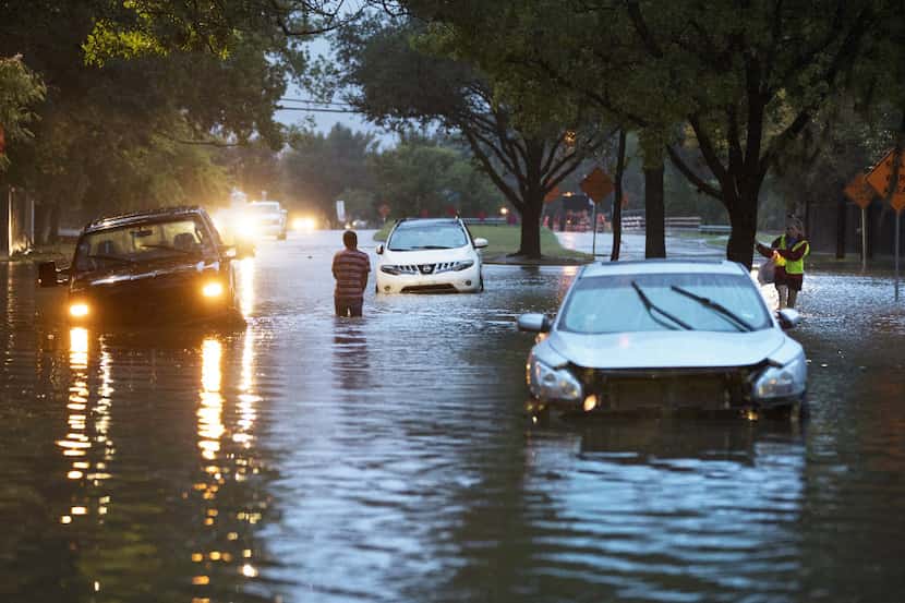 HOUSTON, TX - AUGUST 28: Stranded vehicles sit where they got stuck in high water from...