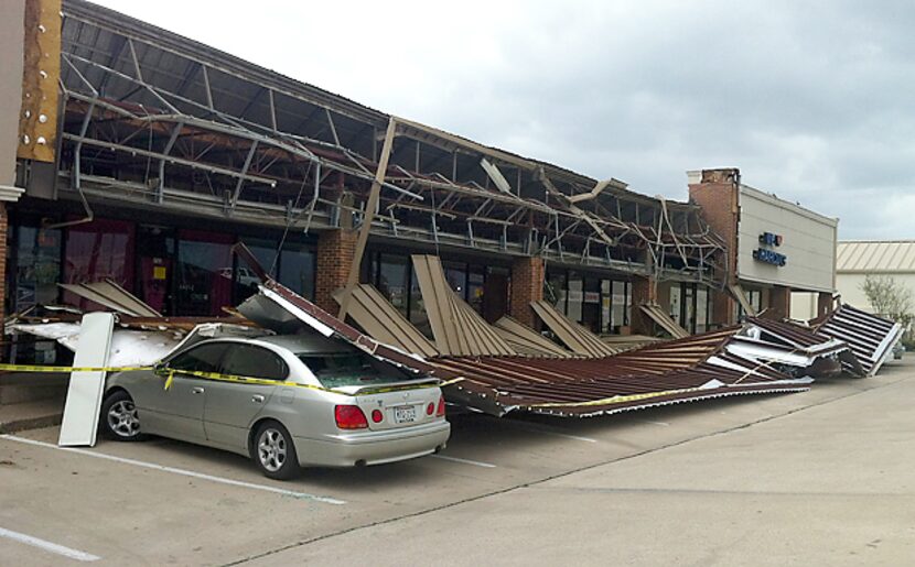 High winds ripped the facade off a strip shopping center Monday afternoon in the 700 block...