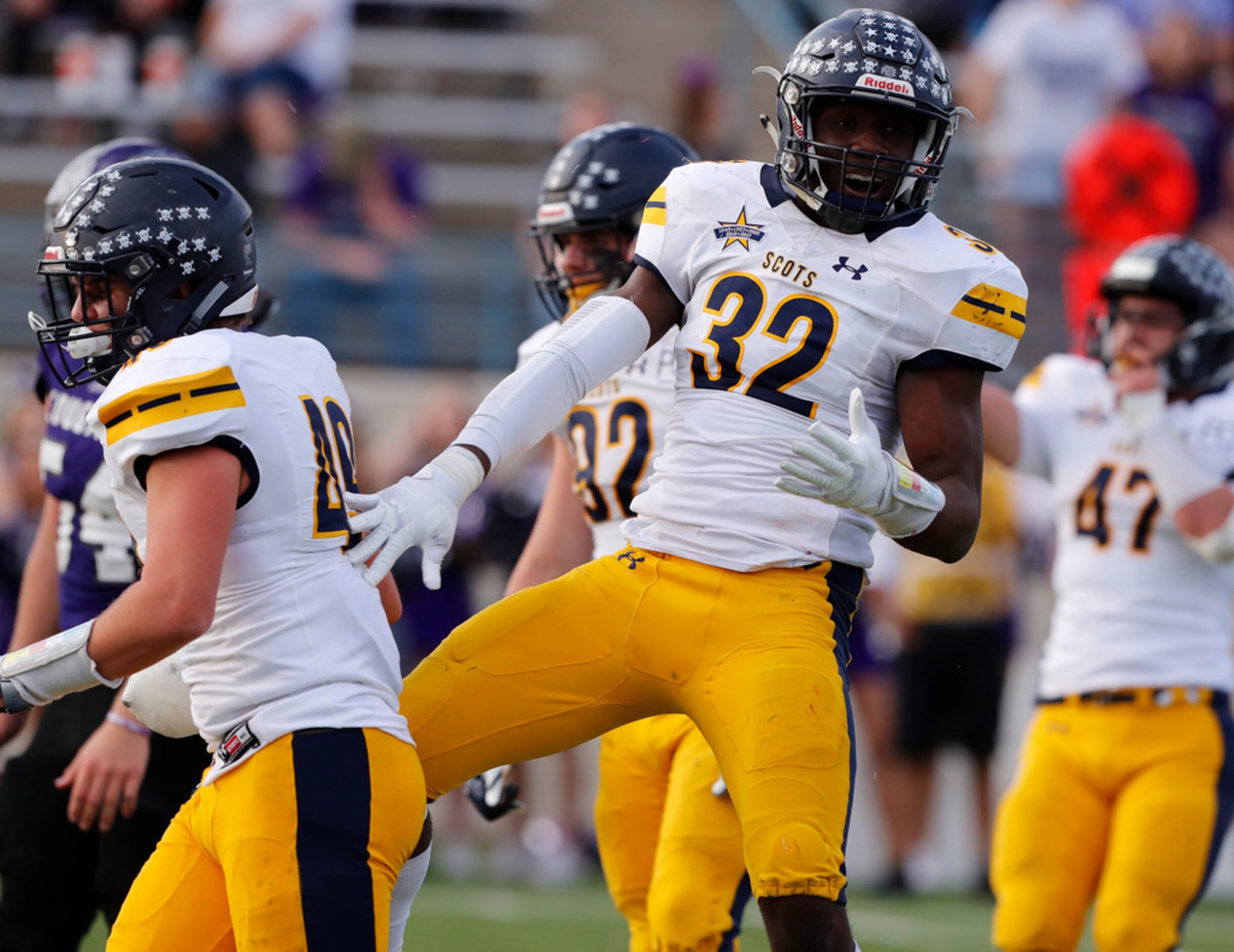 Highland Park DL Prince Dorbah (32) celebrates his sack during the second half of a 5A UIL...