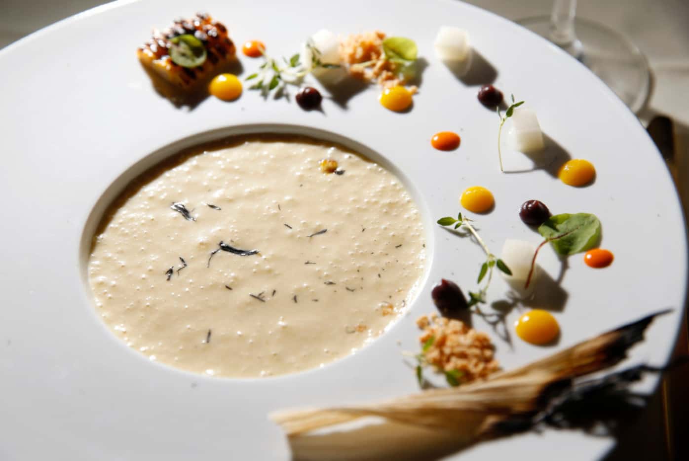 Sopa de chayote, a soup in the Purepecha Room, is garnished with (Vernon Bryant/The Dallas...