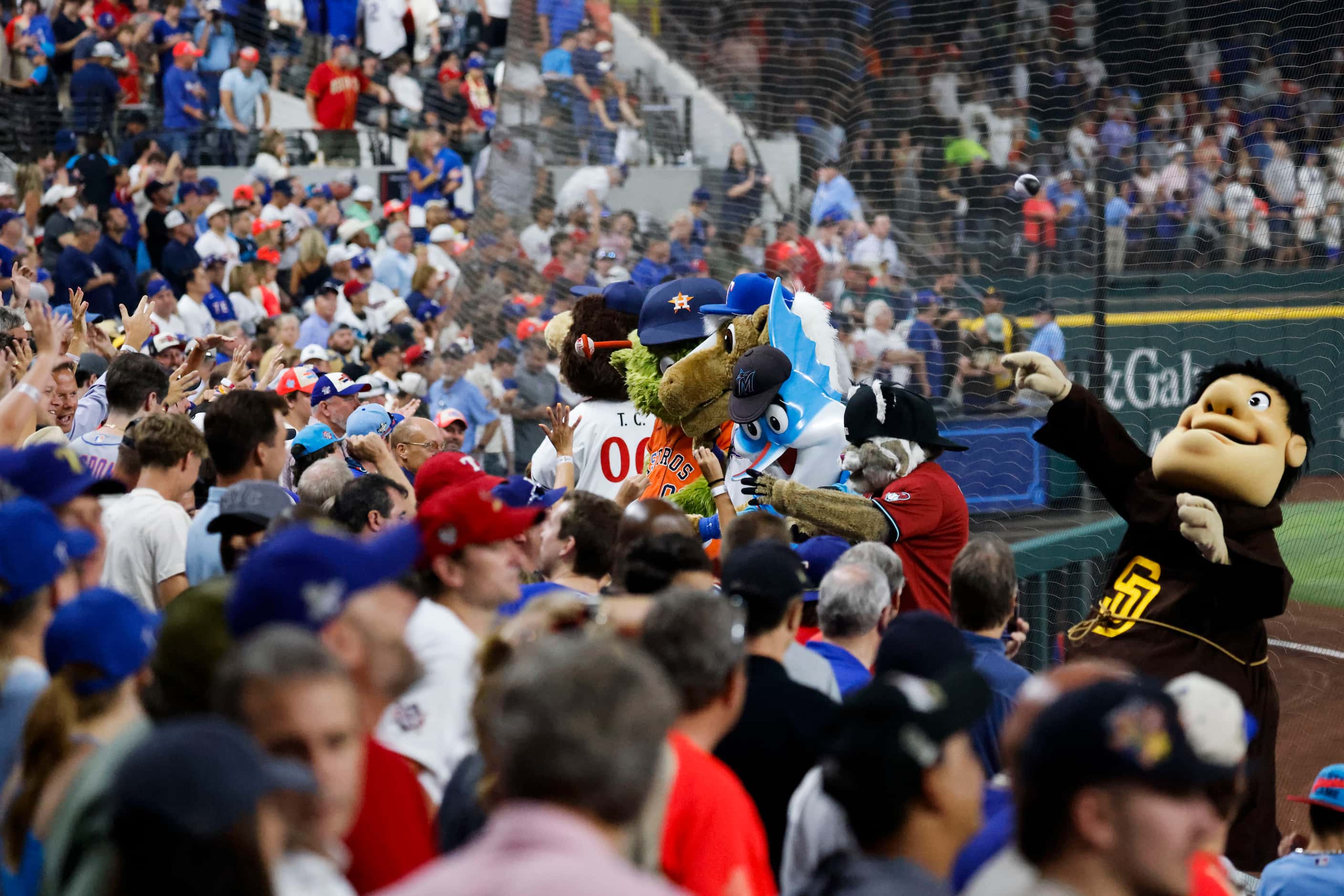 National League mascots throw softball to the crowd during MLB All-Star baseball game, on...