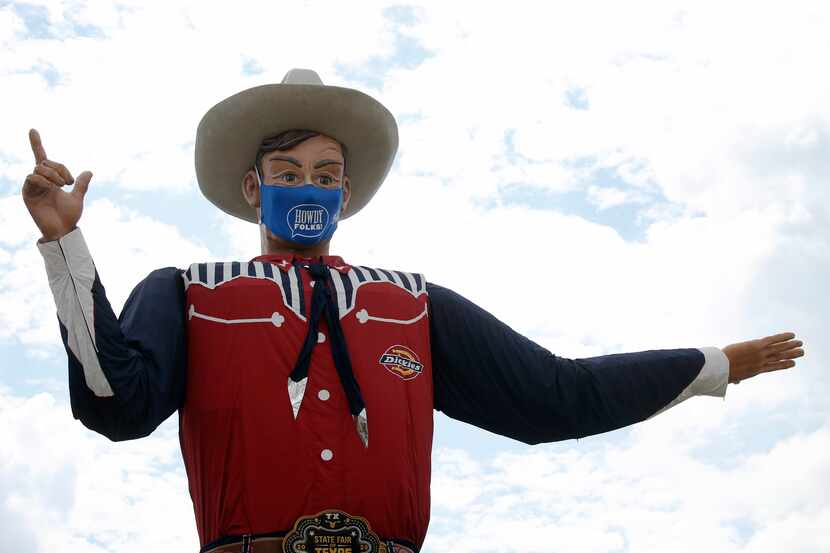 Big Tex sports a howdy folks face mask at Fair Park in Dallas on Wednesday, September 16,...