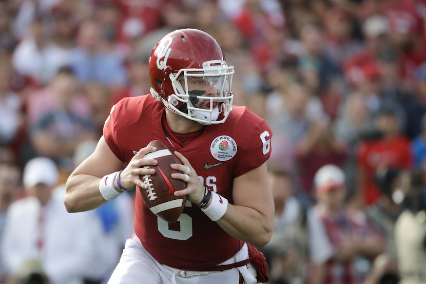 FILE - Oklahoma quarterback Baker Mayfield pulls back to throw a pass during the Rose Bowl...