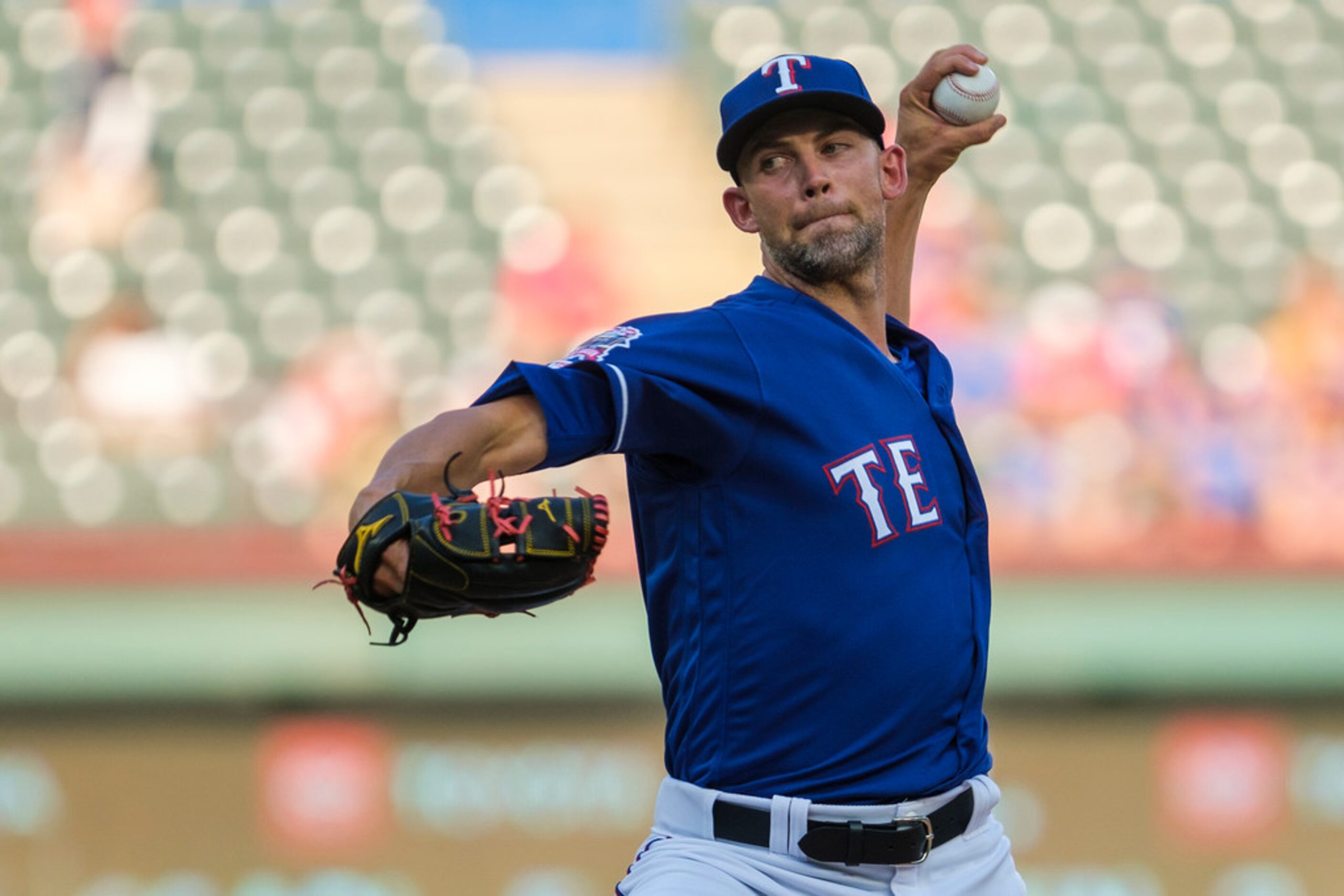 Texas Rangers starting pitcher Mike Minor delivers during the first inning against the...